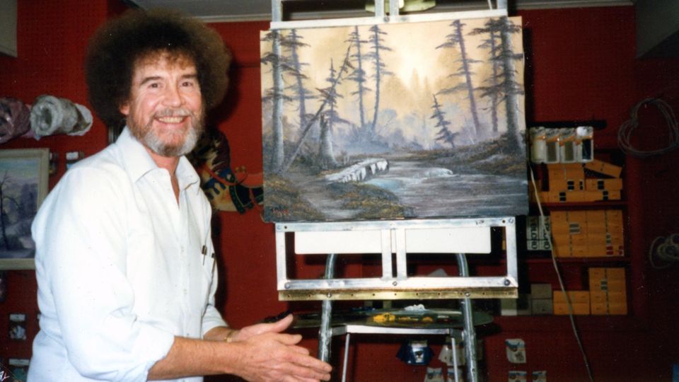 Bob Ross vor einem seiner Gemälde