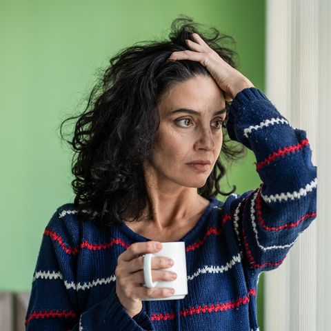 Stress: A woman gets her hair and looks into the distance
