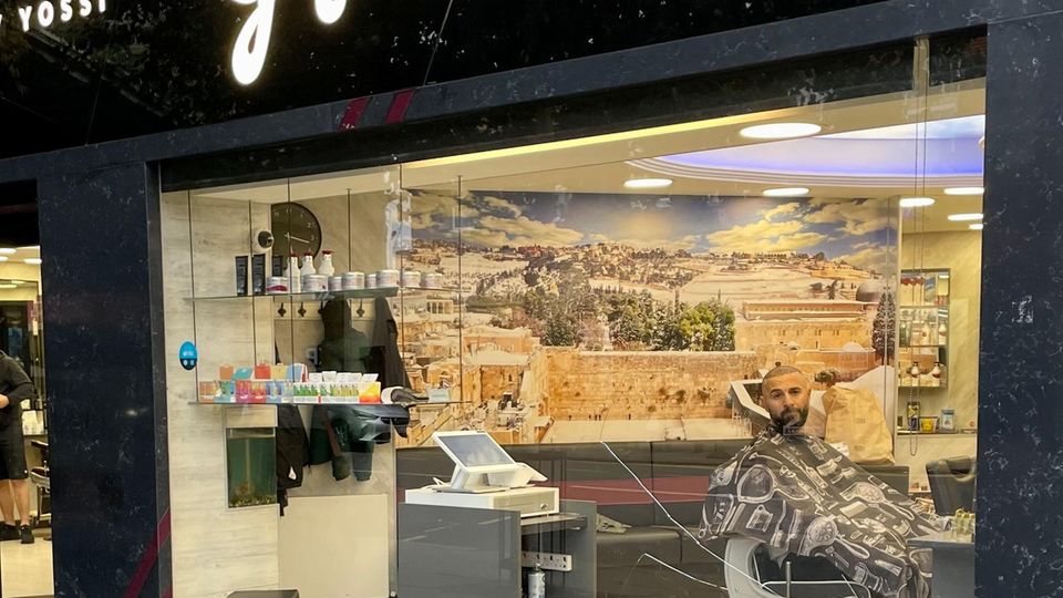 Wailing Wall as wallpaper: A barber shop in Golders Green in London Wailing Wall as wallpaper: A barbershop in Golders Green in London