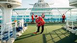 Santas spielen Golf
