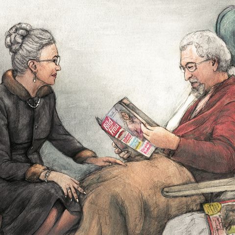 Eine Frau kümmert sich liebevoll um ihren an Demenz erkrankten Ehemann