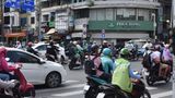 Roller fahren durch eine Straße in Ho-Chi-Minh-Stadt