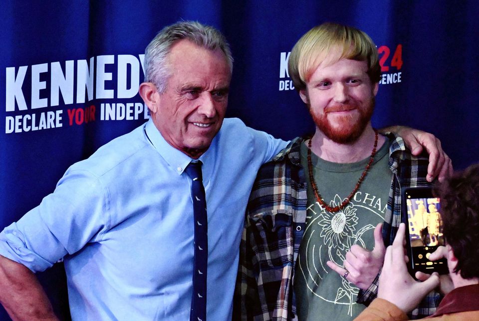 Robert F Kennedy Trump Independent candidate Robert F. Kennedy Jr. (l.) with a young supporter
