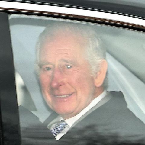 Charles and Camilla wave from the car