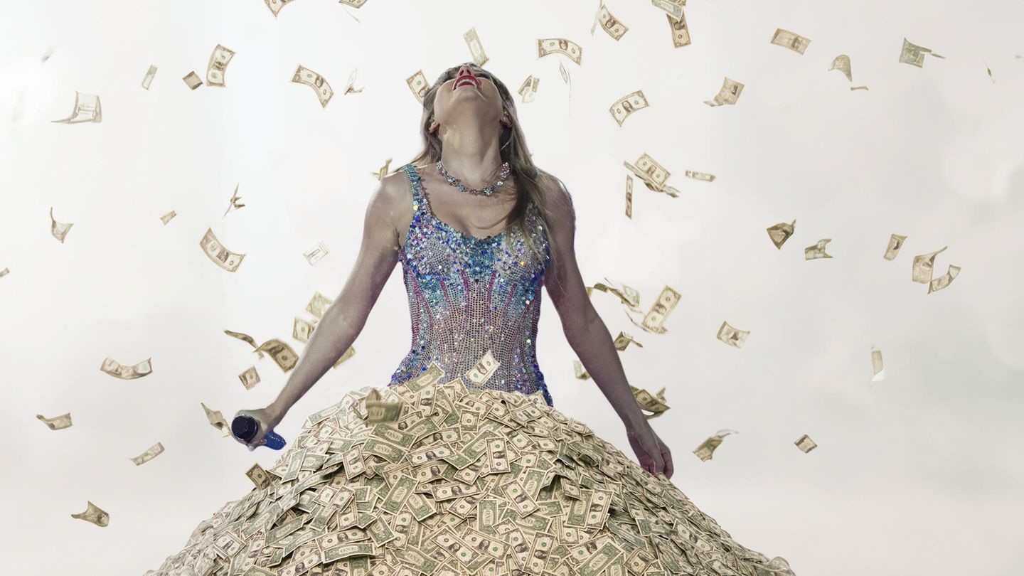 1 Milliarde US-Dollar Taylor Swift steht in einem Haufen Geld
