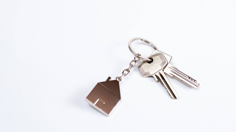 Immobilie: Schlüssel mit Hausanhänger