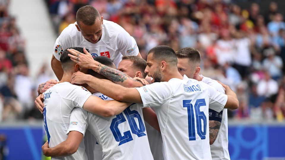 Slovakia's players celebrate their winning goal in the European Championship match against Belgium