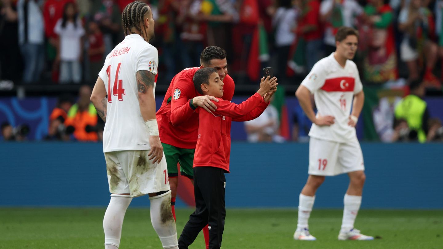 Euro 2024: Boy runs onto field for selfie with Ronaldo