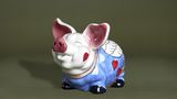 Ein Sparschwein von Hans Eichel mit großen Ohren