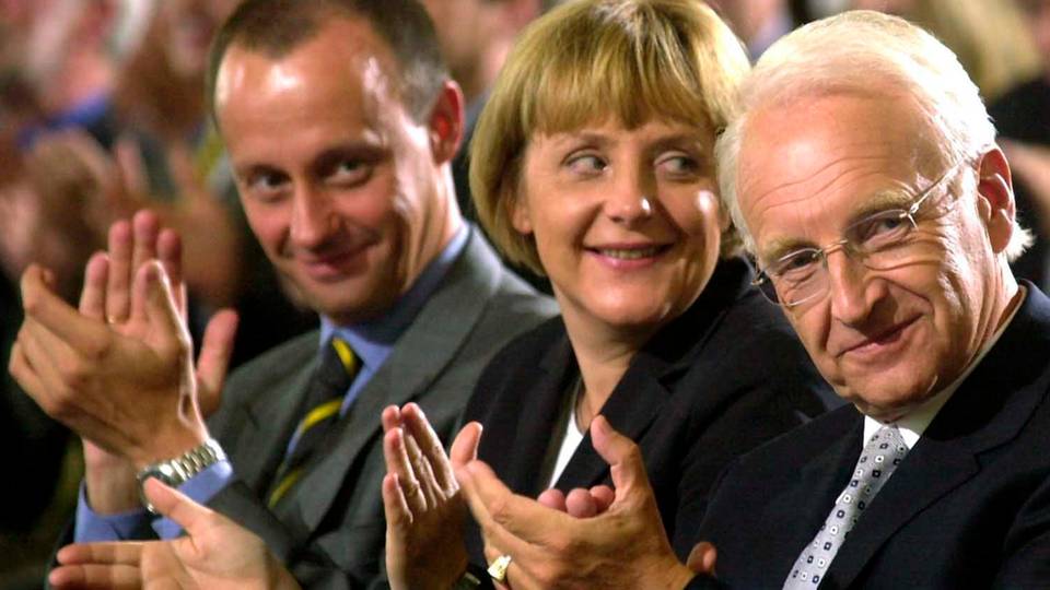 Merkel mit ihren einstigen Rivalen Friedrich Merz und Edmund Stoiber