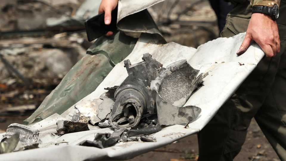 A soldier carries part of a rocket after the Russian air strike at the children's hospital in Kiev A soldier carries part of a rocket after the Russian air strike at the children's hospital in Kiev