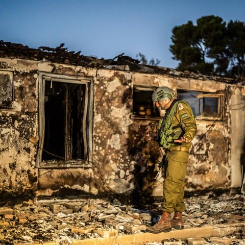 A soldier is in the destroyed Kibbutz Be'eri in Israel