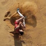 Weiche Landung: Die Japanerin Mariko Morimoto landet beim Dreisprung in der Sandgrube.