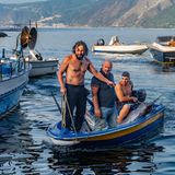 Drei Männer in einem Schiffersboot