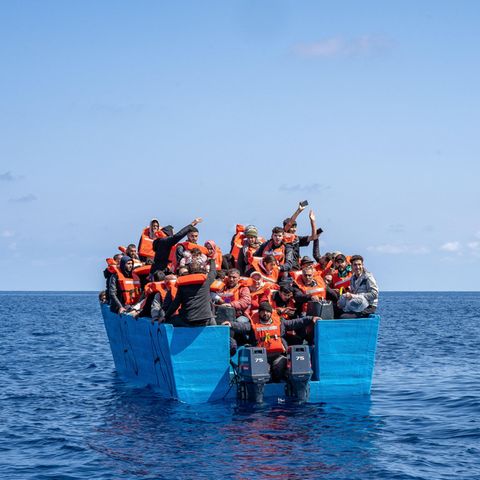 Refugees in a wooden boat on the Mediterranean, March 2024