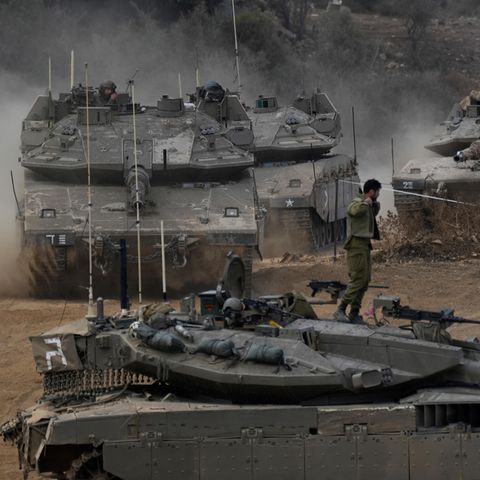 Tanks of the Israeli army maneuver in a deployment area in northern Israel near the Israeli-Libanese border 