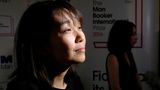 Die südkoreanische Schriftstellerin Han Kang sieht in einem Portrait nach rechts.