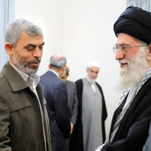 Very good friends: Ex-Hamas boss Yahya Sinwar (left) greets Iran's religious leader Ayatollah Chamenei