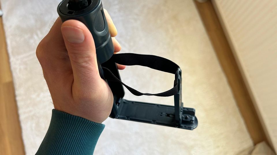 The handle of the cupbrella in the hand