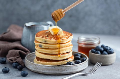 Fluffy buttermilk blueberry pancakes with honey