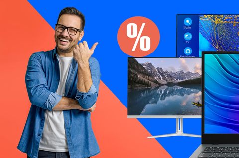 Mann lacht begeistert und zeigt auf die Black-Friday-Deals von Medion.