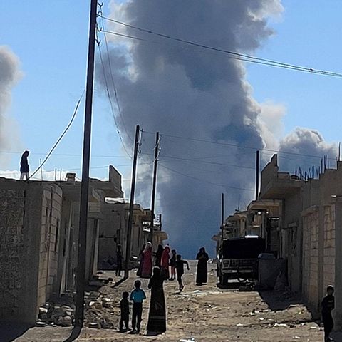 Columns of smoke rise over the industrial district of Palmyra, where the Israeli Air Force bombed a warehouse