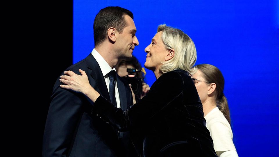 RN leader Jordan Bardella and party leader Marine Le Pen at an event in Nice in October