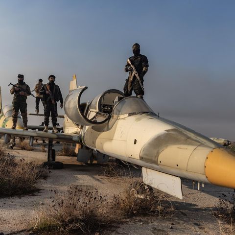 Syria: Rebels with captured Assad regime fighter jet