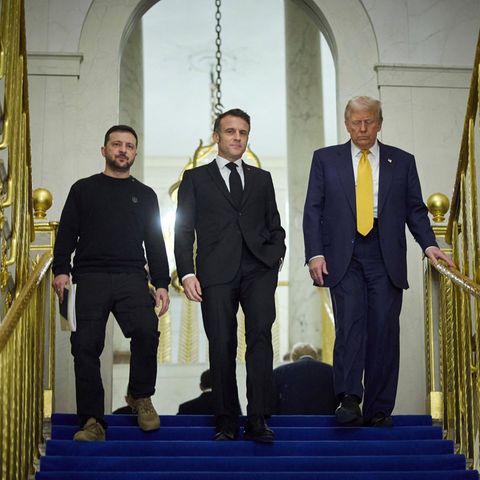 Ukrainian President Volodymyr Zelenskyy, left, with French President Emmanuel Macron, center, and US President-elect Donald Trump, at the Elysee Palace