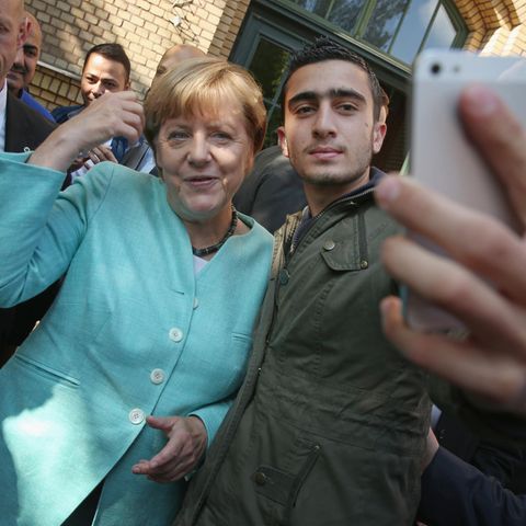 Syria: Anas Modamani and Angela Merkel