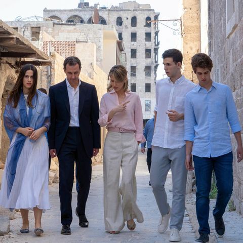 Ousted Syrian President Bashar Assad (second from left) and his wife Asma (center) with their children Zein (left), Karim (right) and Hafez (left) in front of the Great Mosque of Aleppo, Syria, in July 2022