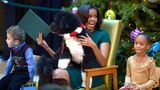 Michelle Obama mit Hund Bo auf dem Schoß