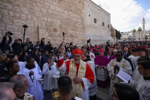 Latin Patriarch of Jerusalem Pierbattista Pizzaballa leads a Christmas procession outside the Church of the Nativity in Bethlehe
