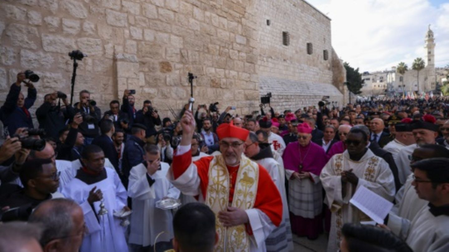 Latin Patriarch of Jerusalem Pierbattista Pizzaballa leads a Christmas procession outside the Church of the Nativity in Bethlehe