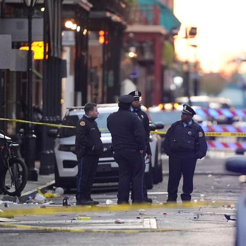 Emergency crews at the scene in New Orleans where a car plowed into a crowd on Bourbon Street