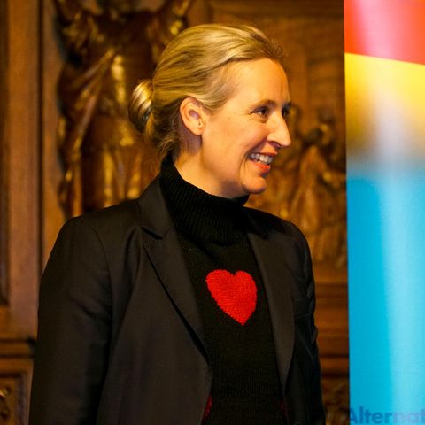 Alice Weidel wears a sweater with a heart symbol