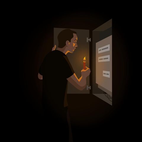 Illu from a man standing in front of a power box with a candle
