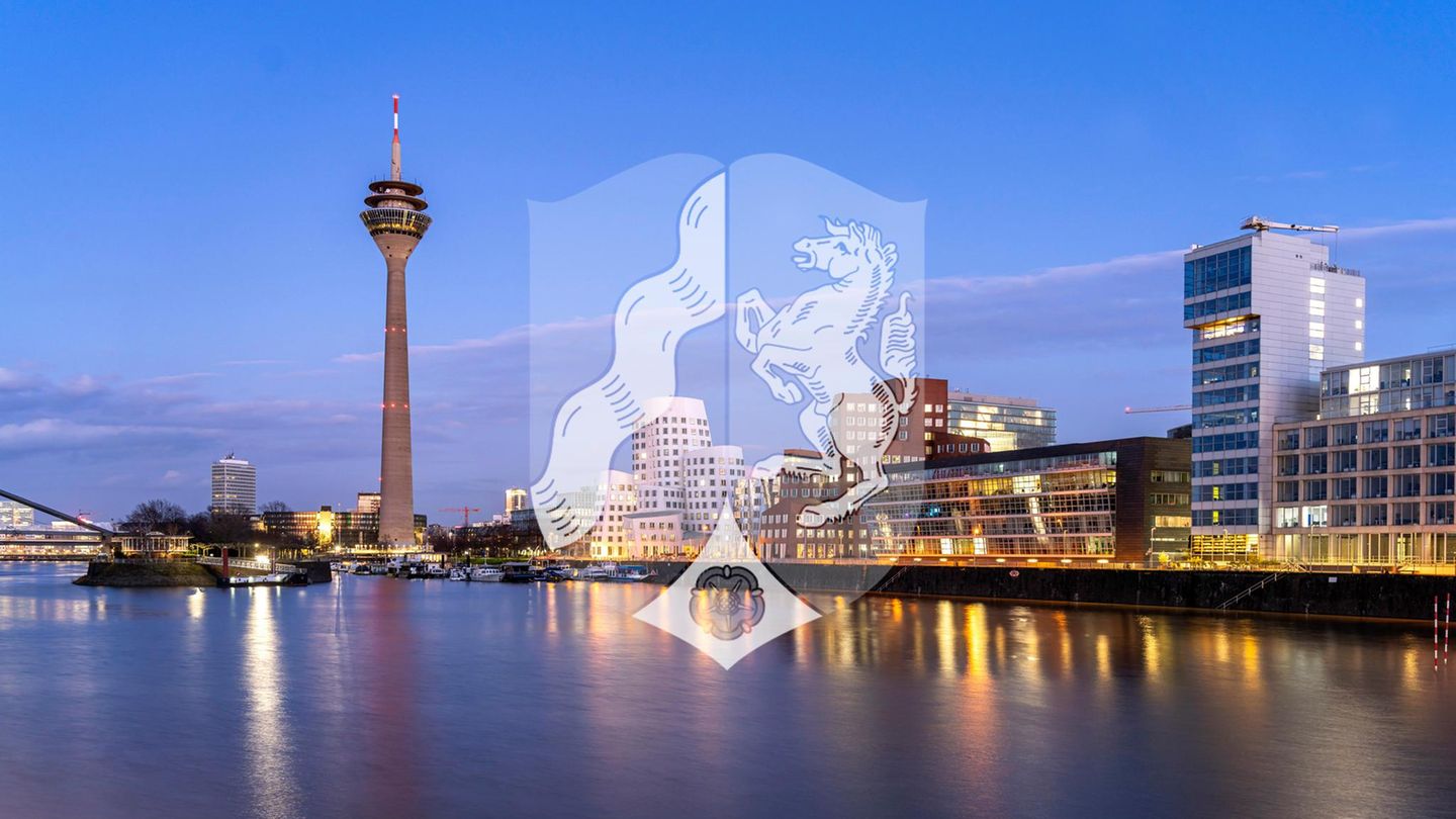 Abendstimmung am Rhein in Düsseldorf mit Wappen Nordrhein-Westfalens, Düsseldorf hat zwei Wahlkreise Abendstimmung am Rhein in Düsseldorf mit Wappen Nordrhein-Westfalens, Düsseldorf hat zwei Wahlkreise