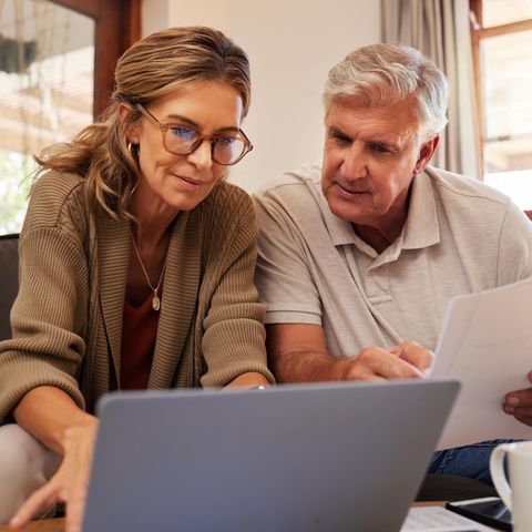 Pensioners look in documents