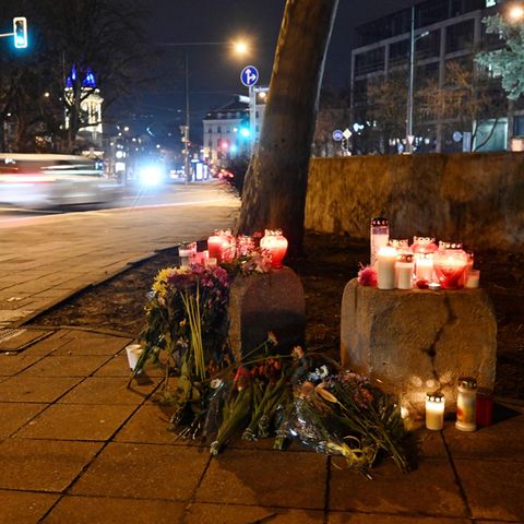 Candles and flowers are not far from the scene of the accident in Munich