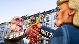 Rosenmontagszug in Düsseldorf Mottowagen: Trump und Putin reichen sich die Hand und zerquetschen die Ukraine