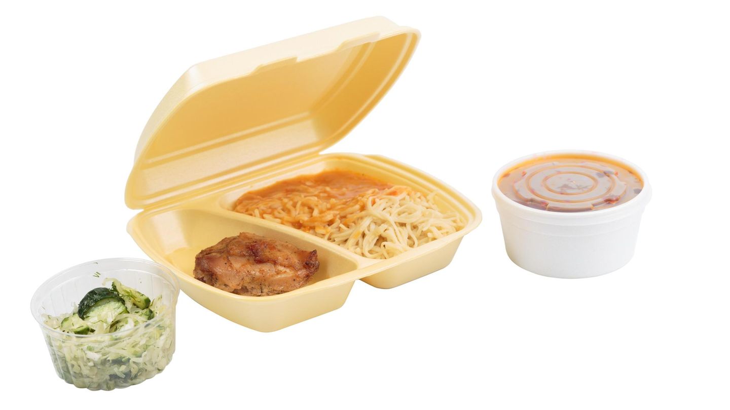 Chicken and pasta in a plastic box for delivery. Isolated over white background. Close-up. Chicken and pasta in a plastic box for delivery. Isolated over white background. Close-up.