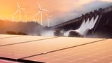 Ein Bild mit Windrädern, Solarpanelen und einem Staudamm