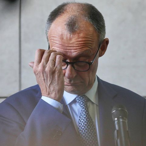 Friedrich Merz scratches his hand on the forehead Union AfD election survey