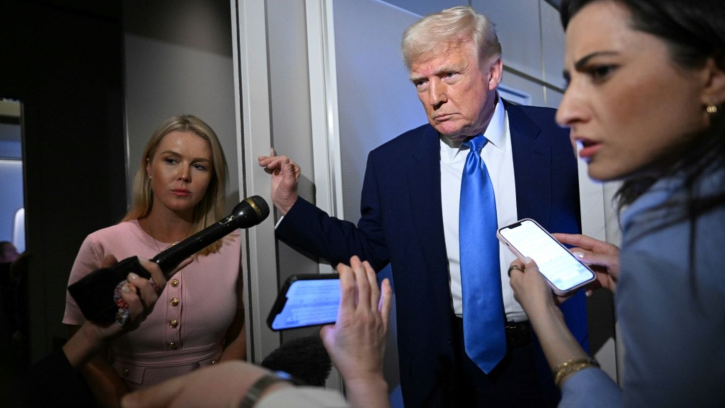 US President Donald Trump speaks to reporters while in flight on Air Force One, en route to Joint Base Andrews on April 6, 2025.
