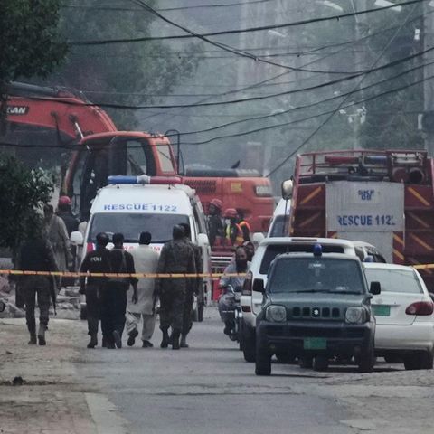 First aiders help in the city in Muridke in the Pakistani province of Punjab