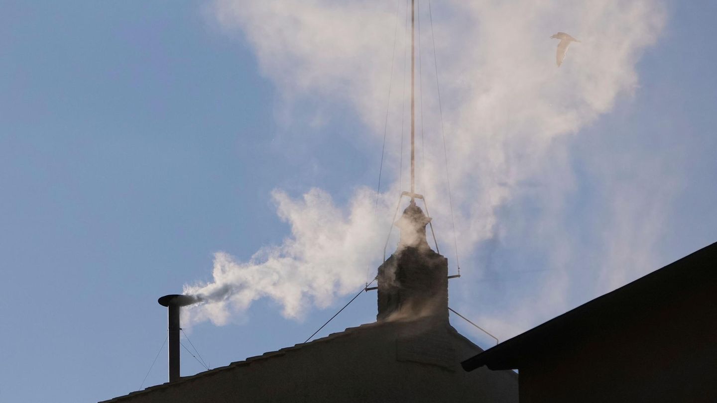White smoke comes from the chimney of the Vatican White smoke comes from the chimney of the Vatican
