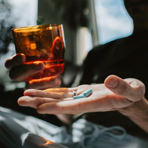 Delivery bottleneck: Hand with two pills