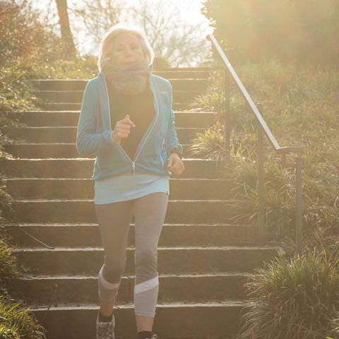 Woman in retirement age while jogging