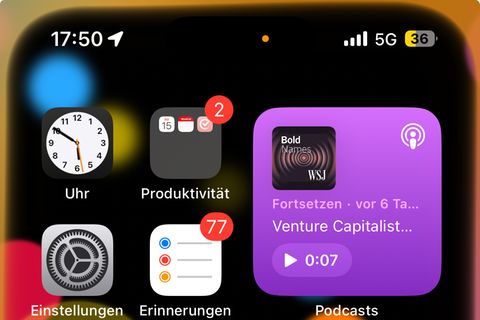 Ein Screenshot eines iPhones zeigt einen gelben Punkt am oberen Rand